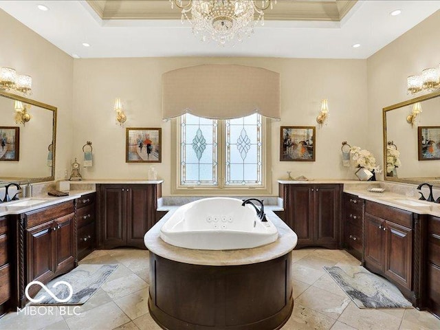 3808 Claybrook Ct, Bargersville, IN 46106 - bathroom featuring a raised ceiling, crown molding, a jetted tub, a chandelier, and two vanities
