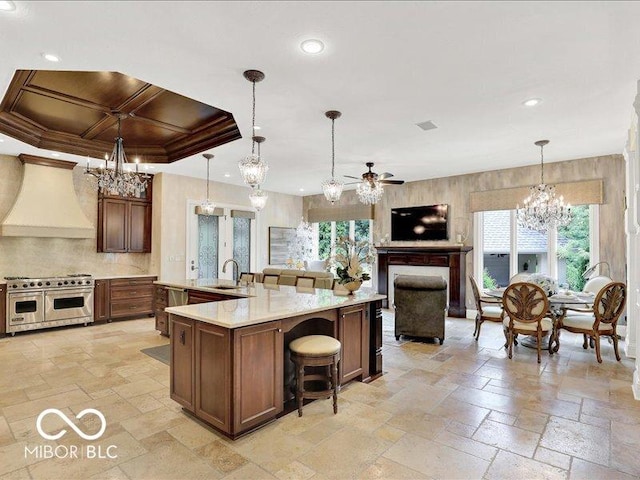 3808 Claybrook Ct, Bargersville, IN 46106 - kitchen featuring premium range hood, double oven range, a chandelier, a ceiling fan, and decorative backsplash