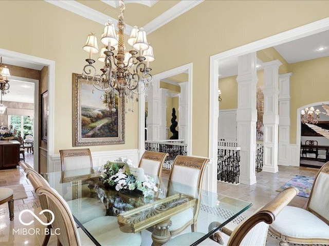 3808 Claybrook Ct, Bargersville, IN 46106 - dining area featuring a decorative wall, a chandelier, ornamental molding, wainscoting, and stone tile floors
