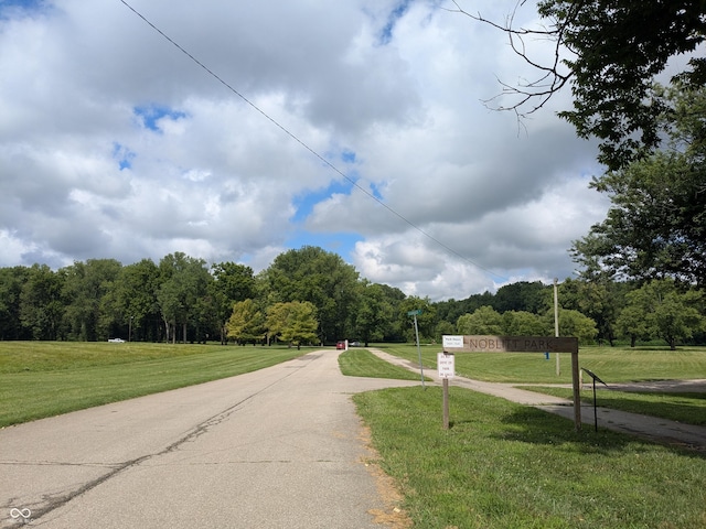 1630 Lawton Ave, Columbus, IN 47201 - view of asphalt road with a wooded view