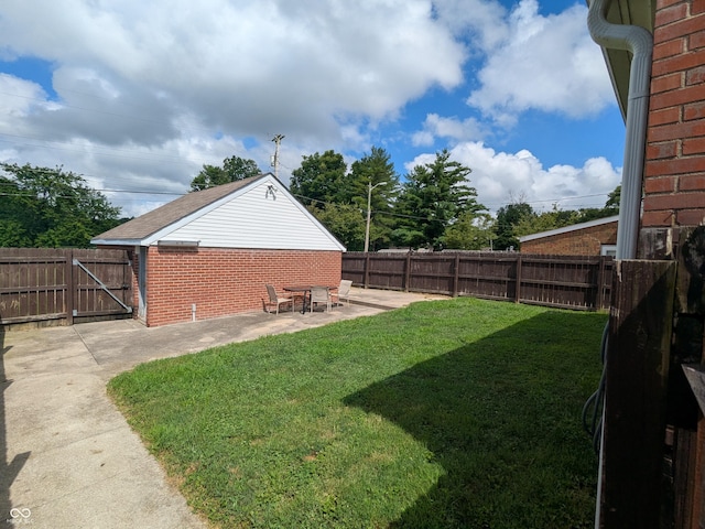 1630 Lawton Ave, Columbus, IN 47201 - fenced backyard with a patio