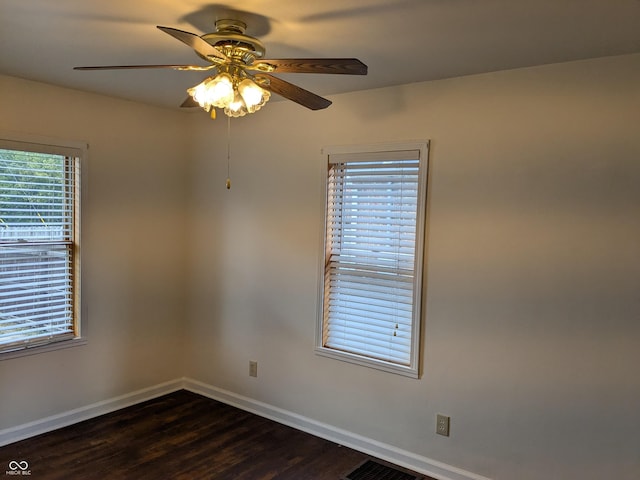 1630 Lawton Ave, Columbus, IN 47201 - unfurnished room with ceiling fan and dark wood-style flooring