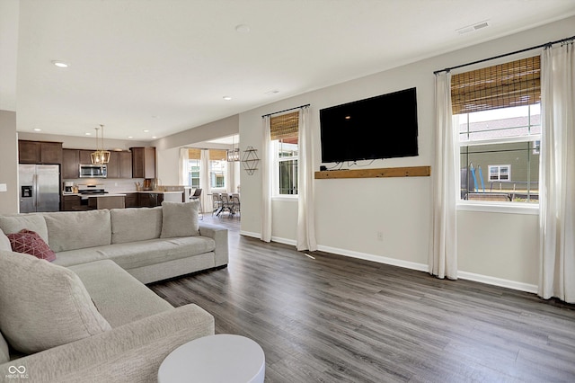 1715 Beyers St, Fortville, IN 46040 - living room featuring dark wood-style floors, a chandelier, and recessed lighting