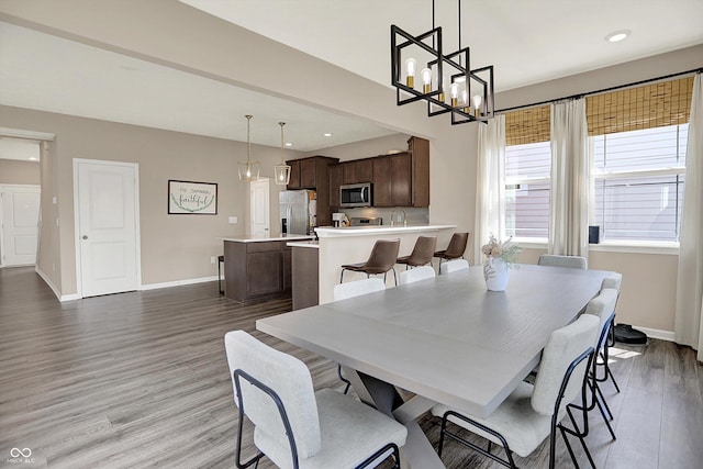 1715 Beyers St, Fortville, IN 46040 - dining space with wood finished floors, recessed lighting, and a chandelier