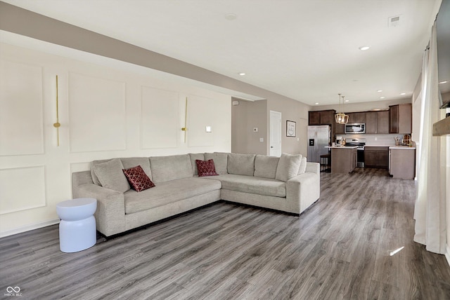 1715 Beyers St, Fortville, IN 46040 - living area featuring wood finished floors and recessed lighting