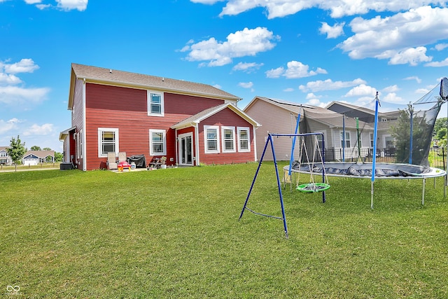 1715 Beyers St, Fortville, IN 46040 - back of property featuring a trampoline and a lawn