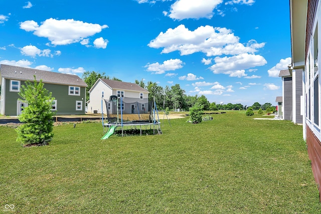 1715 Beyers St, Fortville, IN 46040 - view of green lawn with a trampoline