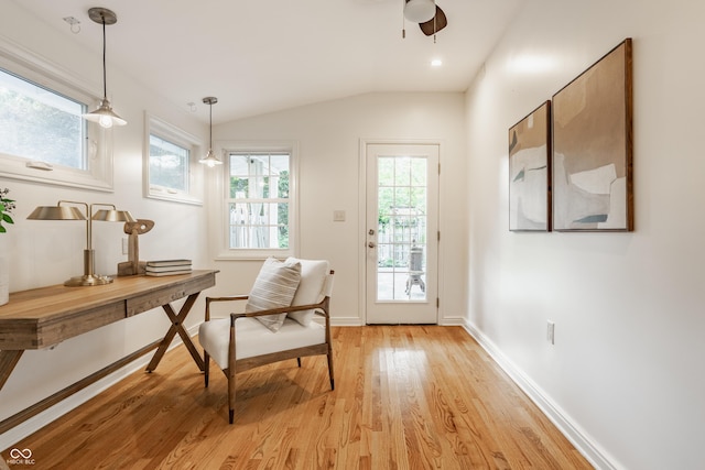 5809 N Washington Blvd, Indianapolis, IN 46220 - doorway to outside with light wood finished floors, ceiling fan, lofted ceiling, and a desk