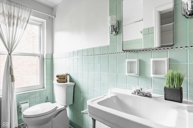 5809 N Washington Blvd, Indianapolis, IN 46220 - bathroom featuring tile walls and a sink
