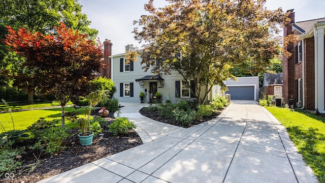 5809 N Washington Blvd, Indianapolis, IN 46220 - view of front facade with a front yard and a garage