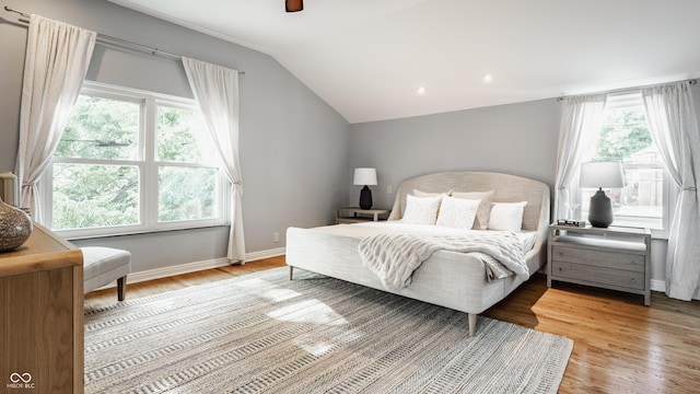 5809 N Washington Blvd, Indianapolis, IN 46220 - bedroom with light wood-type flooring, vaulted ceiling, a ceiling fan, and recessed lighting