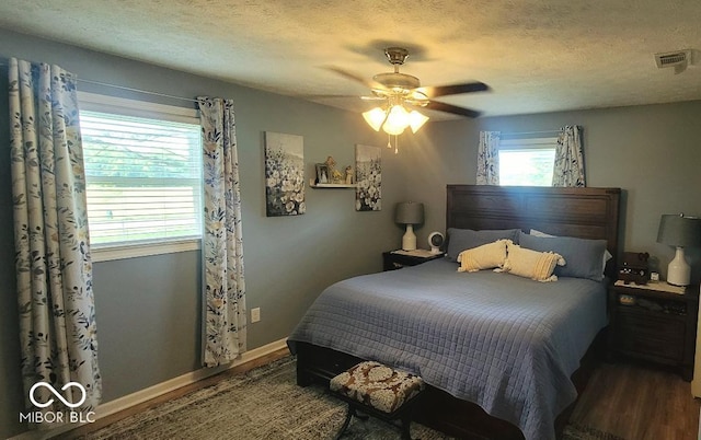 6974 S County Road 400 E, Clayton, IN 46118 - bedroom with wood finished floors, ceiling fan, and a textured ceiling