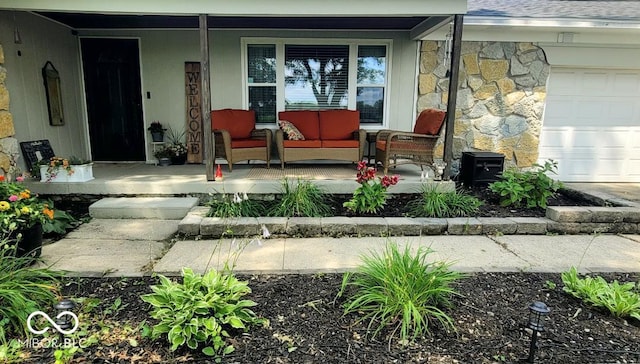 6974 S County Road 400 E, Clayton, IN 46118 - entrance to property featuring covered porch, stone siding, and a garage