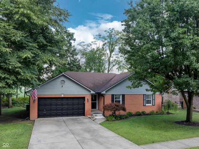 456 Old Hickory Ln, Greenwood, IN 46142 - single story home featuring concrete driveway, an attached garage, brick siding, and a front lawn