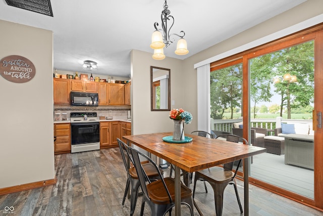 456 Old Hickory Ln, Greenwood, IN 46142 - dining room featuring dark wood-style flooring and a chandelier