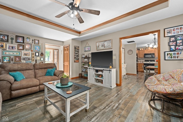456 Old Hickory Ln, Greenwood, IN 46142 - living room featuring a tray ceiling, hardwood / wood-style flooring, a ceiling fan, crown molding, and a chandelier