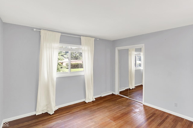 1441 Hunter Pl, Columbus, IN 47203 - unfurnished room featuring hardwood / wood-style floors and baseboards