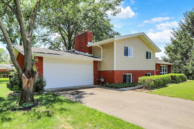 1441 Hunter Pl, Columbus, IN 47203 - view of front of house featuring a chimney, a garage, driveway, brick siding, and a front lawn