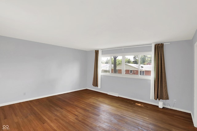 1441 Hunter Pl, Columbus, IN 47203 - spare room with hardwood / wood-style floors and baseboards