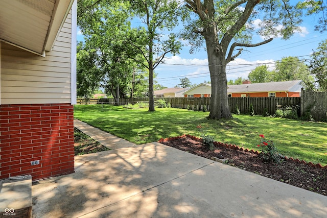 1441 Hunter Pl, Columbus, IN 47203 - fenced backyard with a patio area