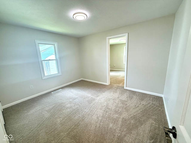 1809 Beam Rd, Columbus, IN 47201 - empty room with carpet flooring and baseboards
