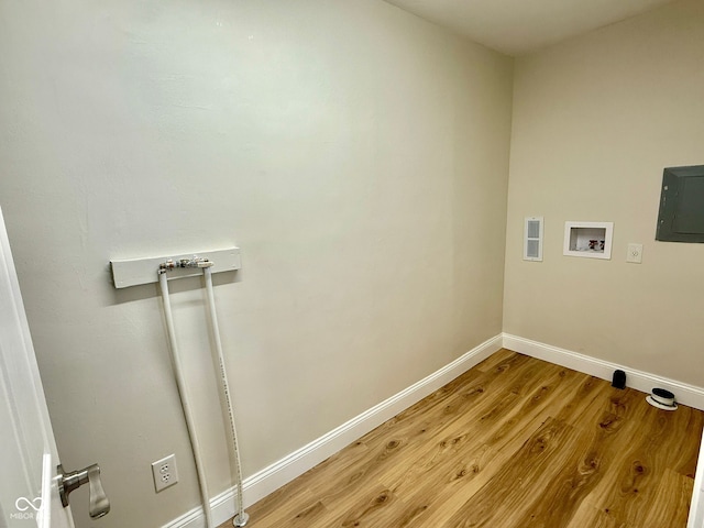1809 Beam Rd, Columbus, IN 47201 - laundry area featuring washer hookup, light wood-style floors, and electric panel