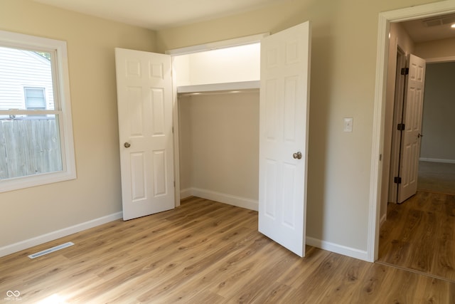 1809 Beam Rd, Columbus, IN 47201 - unfurnished bedroom featuring light wood finished floors and a closet