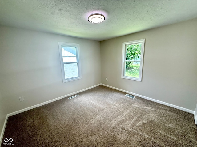 1809 Beam Rd, Columbus, IN 47201 - unfurnished room featuring carpet and a textured ceiling