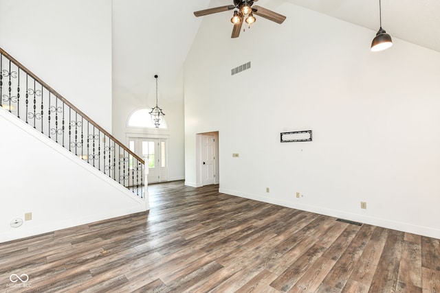 6413 Amber Pass, Plainfield, IN 46168 - unfurnished living room featuring high vaulted ceiling, stairs, ceiling fan, and wood finished floors