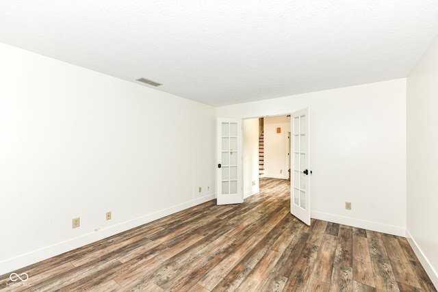 6413 Amber Pass, Plainfield, IN 46168 - spare room with french doors and hardwood / wood-style floors