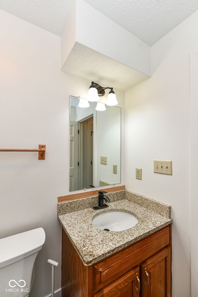 6413 Amber Pass, Plainfield, IN 46168 - half bathroom featuring vanity and a textured ceiling