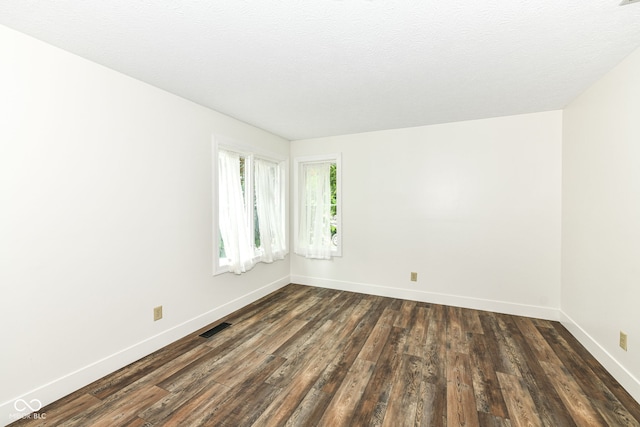 6413 Amber Pass, Plainfield, IN 46168 - spare room with dark wood-style floors and baseboards