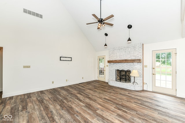6413 Amber Pass, Plainfield, IN 46168 - unfurnished living room featuring high vaulted ceiling, a ceiling fan, wood finished floors, and a brick fireplace