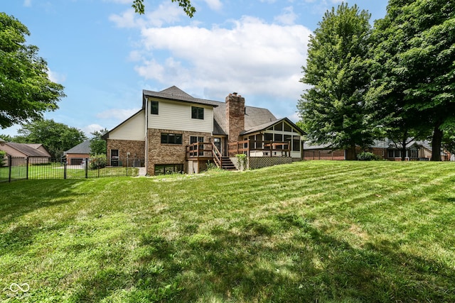 6413 Amber Pass, Plainfield, IN 46168 - back of house featuring a sunroom, a fenced backyard, a deck, brick siding, and stairway