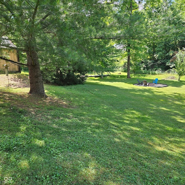 681 Hancock School Rd, Spencer, IN 47460 - view of grassy yard featuring an outdoor fire pit