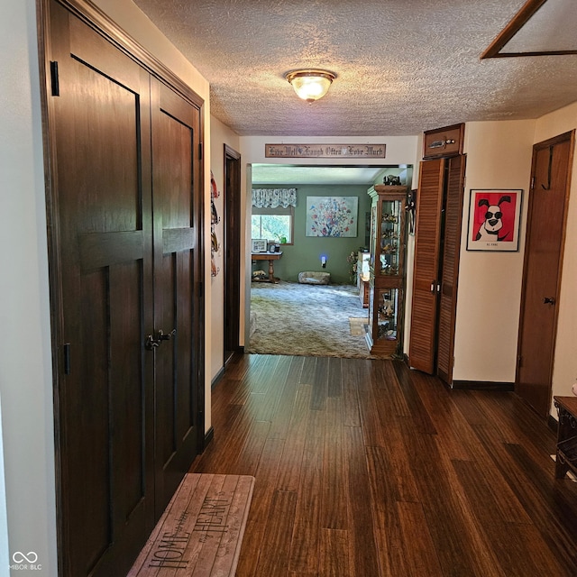 681 Hancock School Rd, Spencer, IN 47460 - hallway featuring a textured ceiling and dark wood-style floors