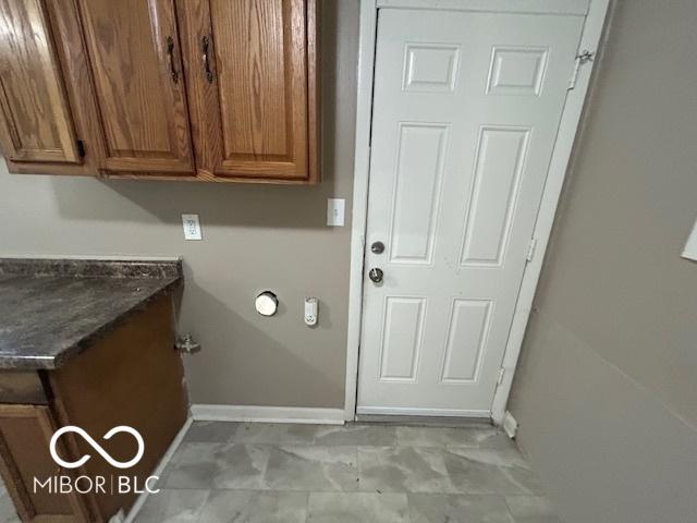 4463 N Bolton Ave, Indianapolis, IN 46226 - laundry room featuring baseboards