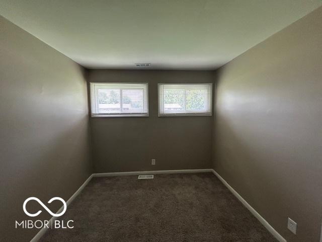 4463 N Bolton Ave, Indianapolis, IN 46226 - carpeted spare room featuring baseboards