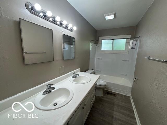 4463 N Bolton Ave, Indianapolis, IN 46226 - full bath featuring double vanity, tub / shower combination, and wood finished floors
