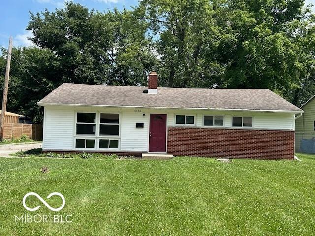 4463 N Bolton Ave, Indianapolis, IN 46226 - ranch-style home featuring a front lawn, a chimney, and brick siding