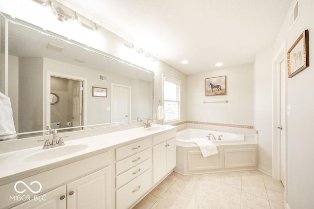 7929 W Bristol Way, New Palestine, IN 46163 - bathroom with a garden tub, double vanity, tile patterned flooring, and recessed lighting