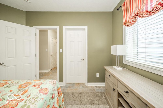 7929 W Bristol Way, New Palestine, IN 46163 - bedroom with baseboards and light tile patterned flooring