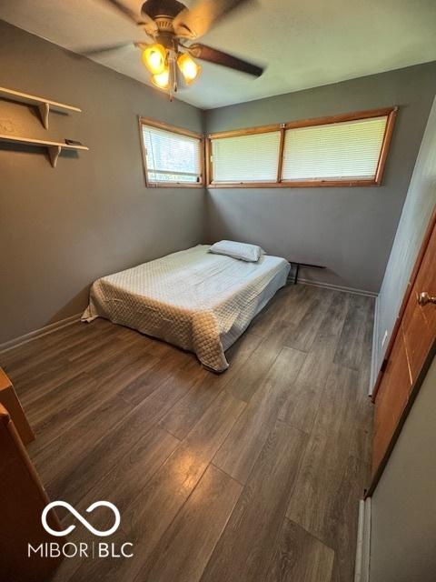 bedroom with wood finished floors and ceiling fan