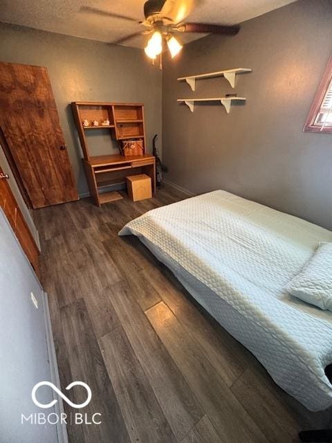bedroom featuring dark wood-type flooring and ceiling fan