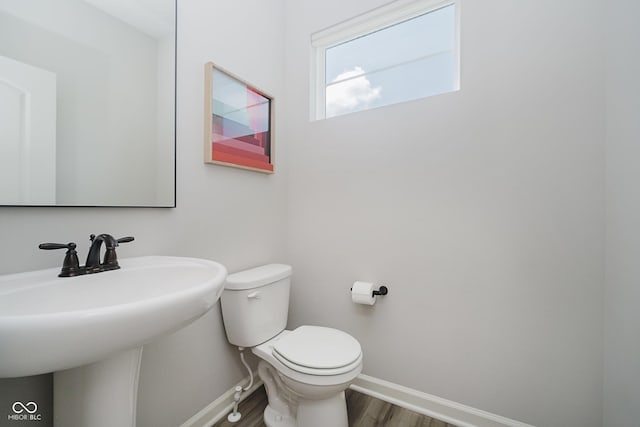 9732 Junction, Fishers, IN 46037 - bathroom with baseboards and wood finished floors