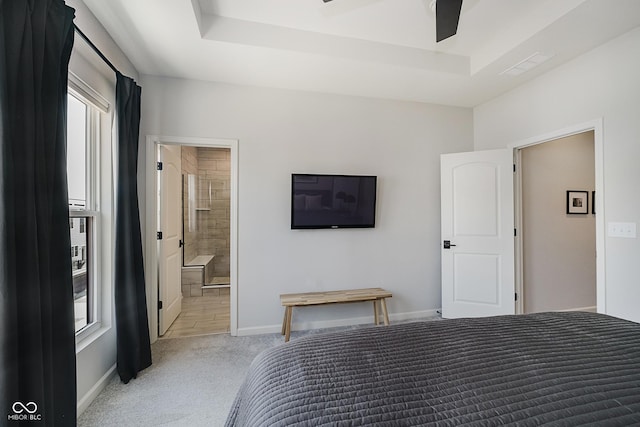 9732 Junction, Fishers, IN 46037 - bedroom with carpet floors, multiple windows, a tray ceiling, and connected bathroom