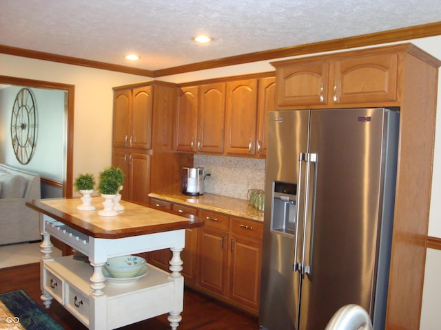 7839 Jessica Ct, Avon, IN 46123 - kitchen featuring high end refrigerator, butcher block counters, dark wood-type flooring, tasteful backsplash, and a textured ceiling