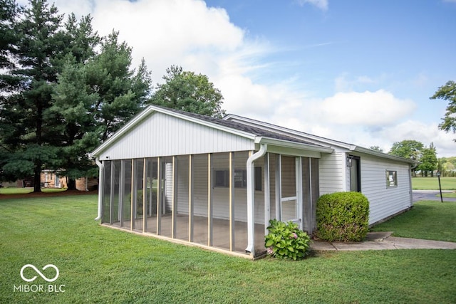 8310 N County Road 700 W, Scipio, IN 47273 - view of side of property with a sunroom and a yard