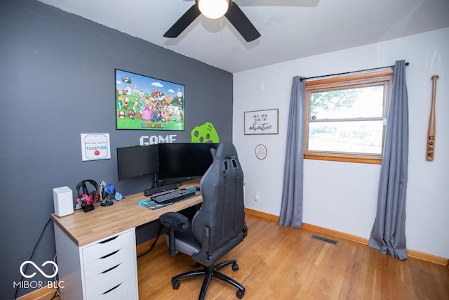 8310 N County Road 700 W, Scipio, IN 47273 - home office featuring ceiling fan and light wood-style floors