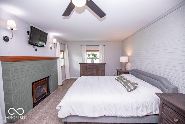 8310 N County Road 700 W, Scipio, IN 47273 - bedroom featuring carpet, brick wall, a brick fireplace, and a ceiling fan